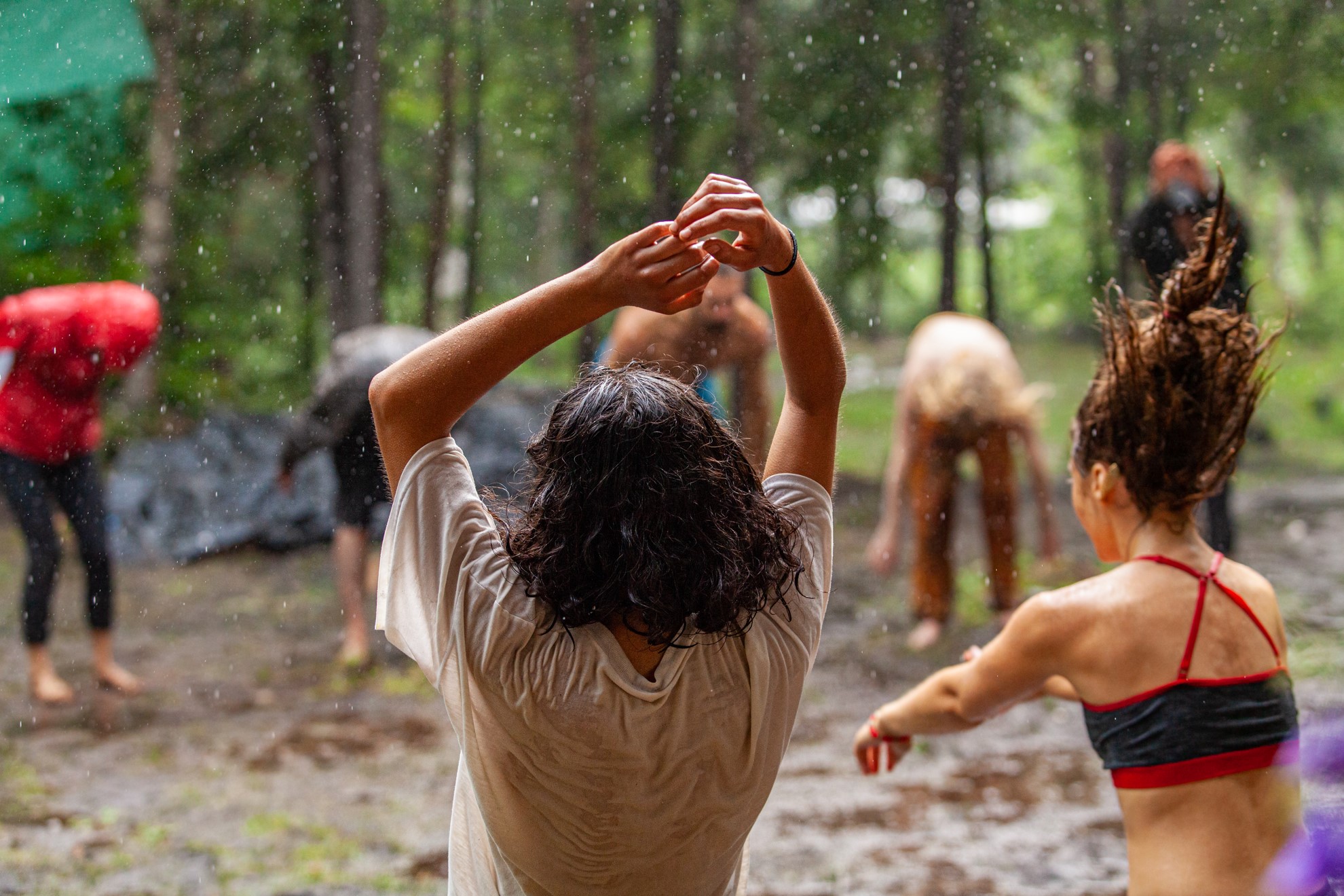 Person dancing in a trance state in a forest, symbolizing spiritual and energetic healing through trance dance