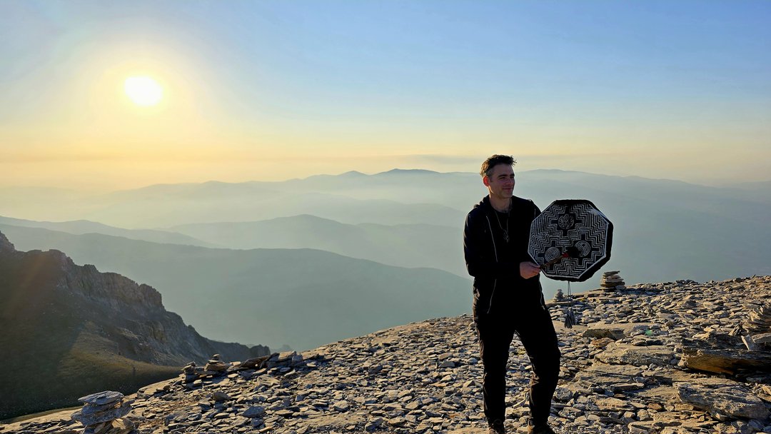 Facilitator guiding the drum meditation session