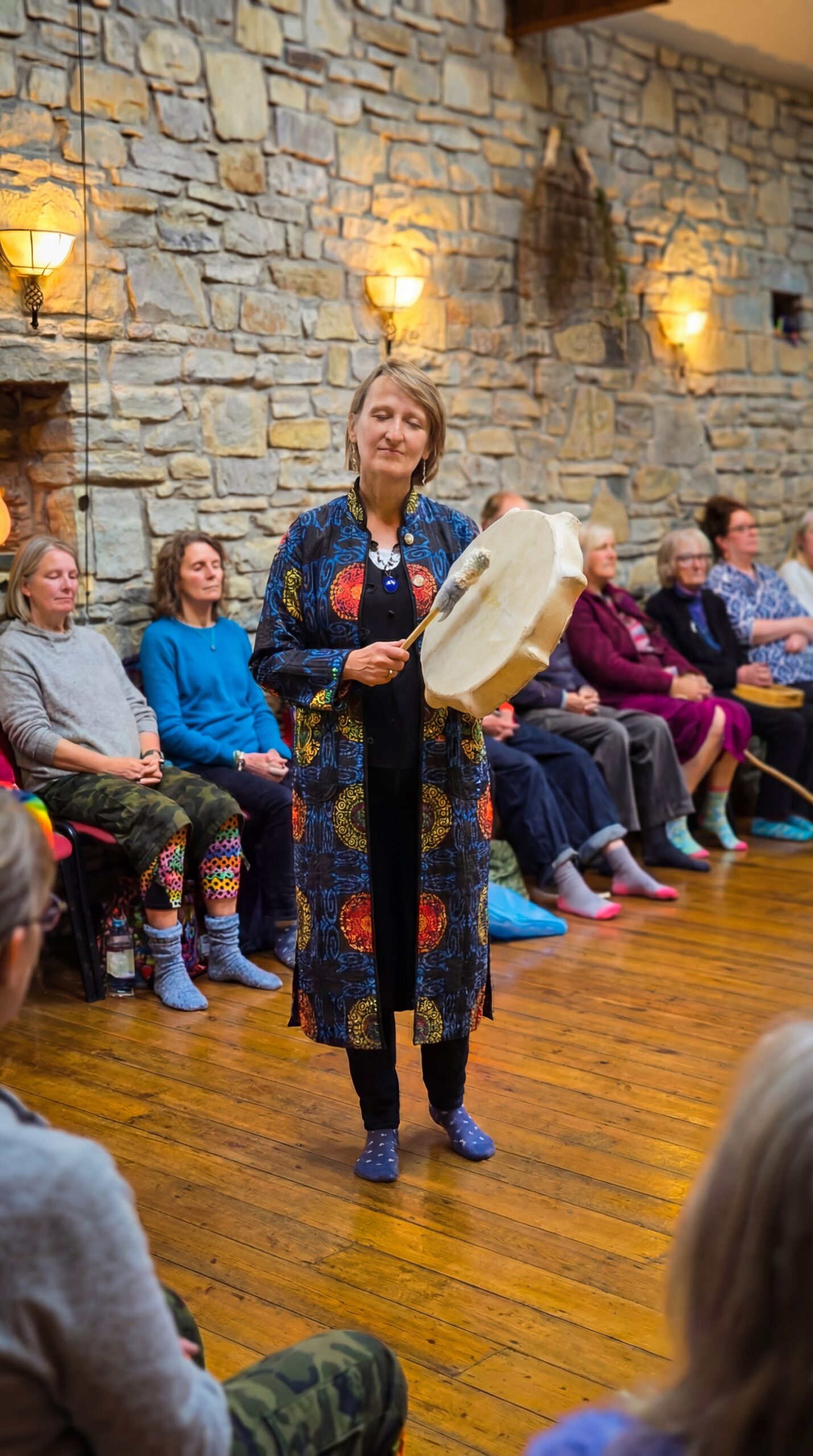Group drum meditation session atmosphere