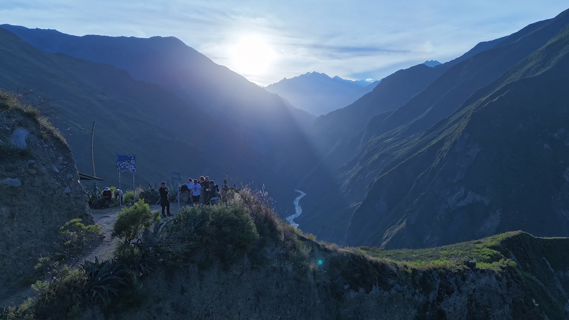 Group overlooking a canyon at sunrise