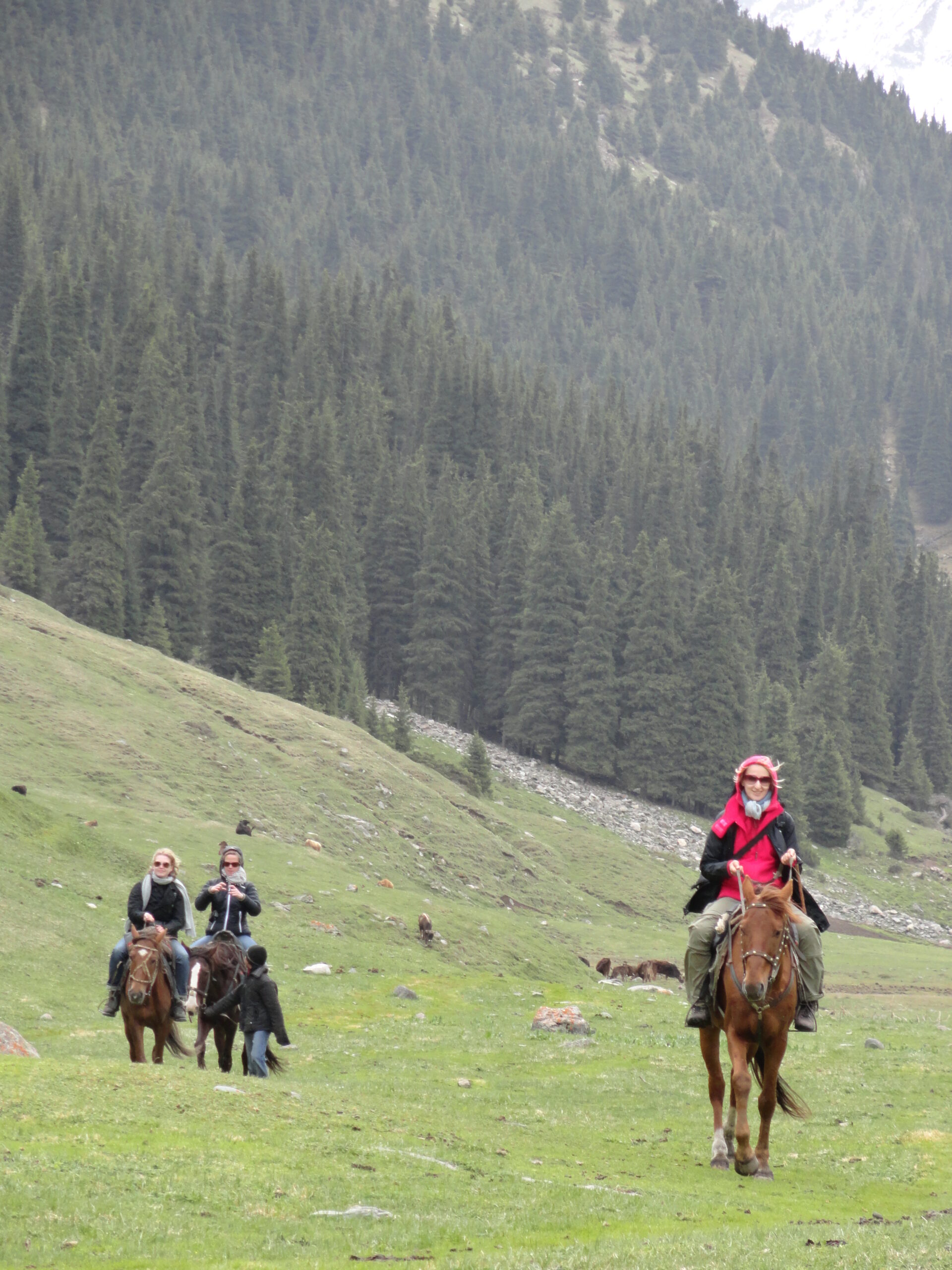 Horse riding in a mountain valley in Kyrgyzstan