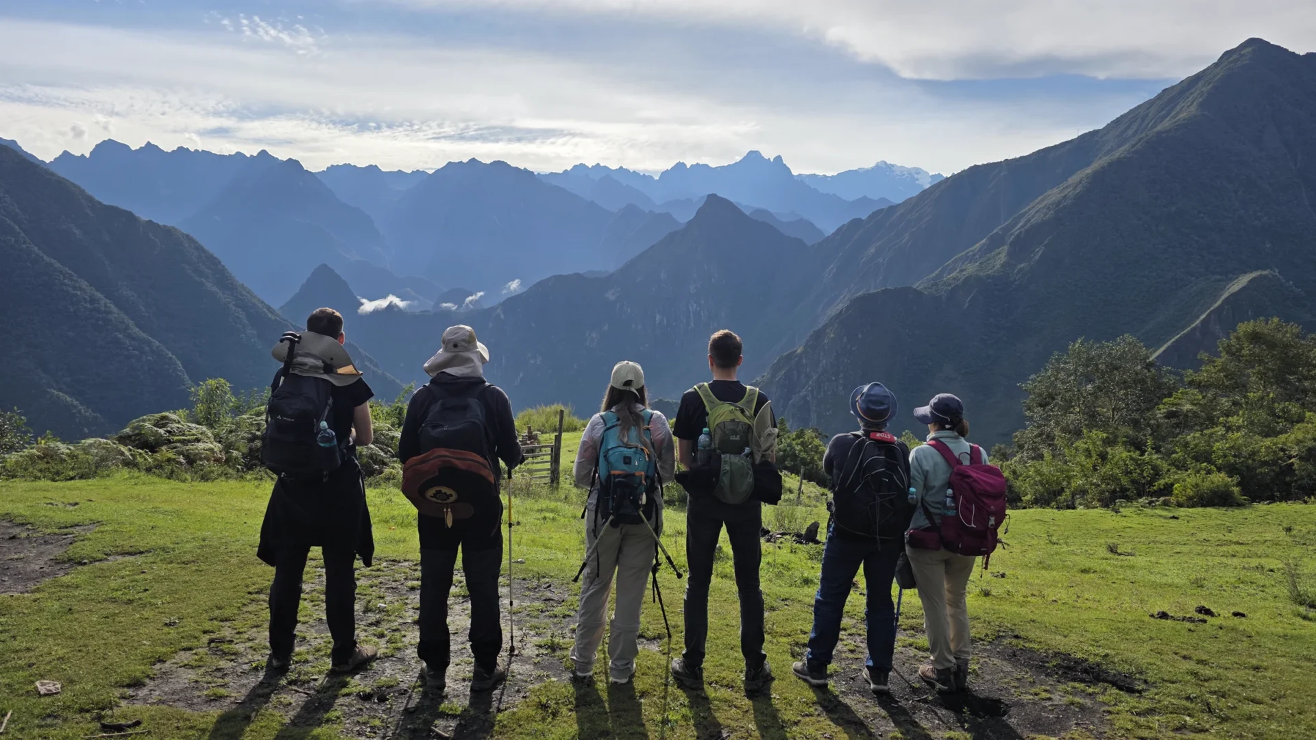 Pilgrims looking together towards the mountains of Peru